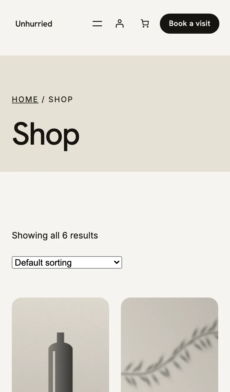 Unhurried Pro's shop page on a phone: breadcrumb, Shop heading and rounded product cards.